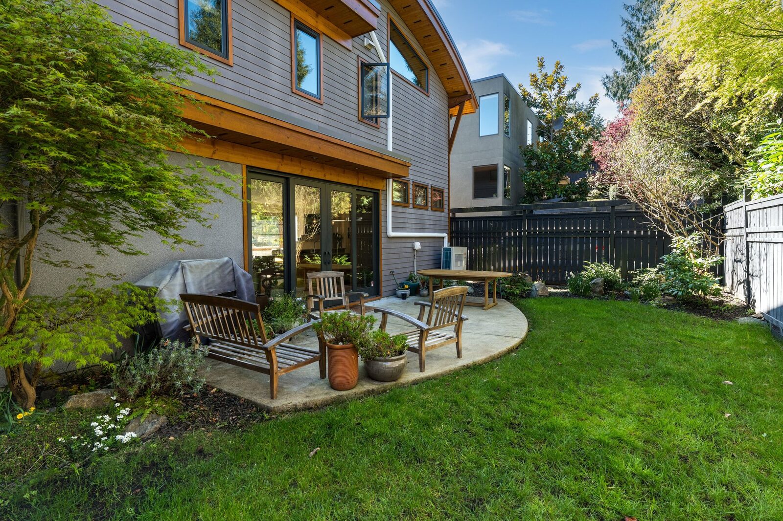 West-facing backyard with patio and landscaped garden