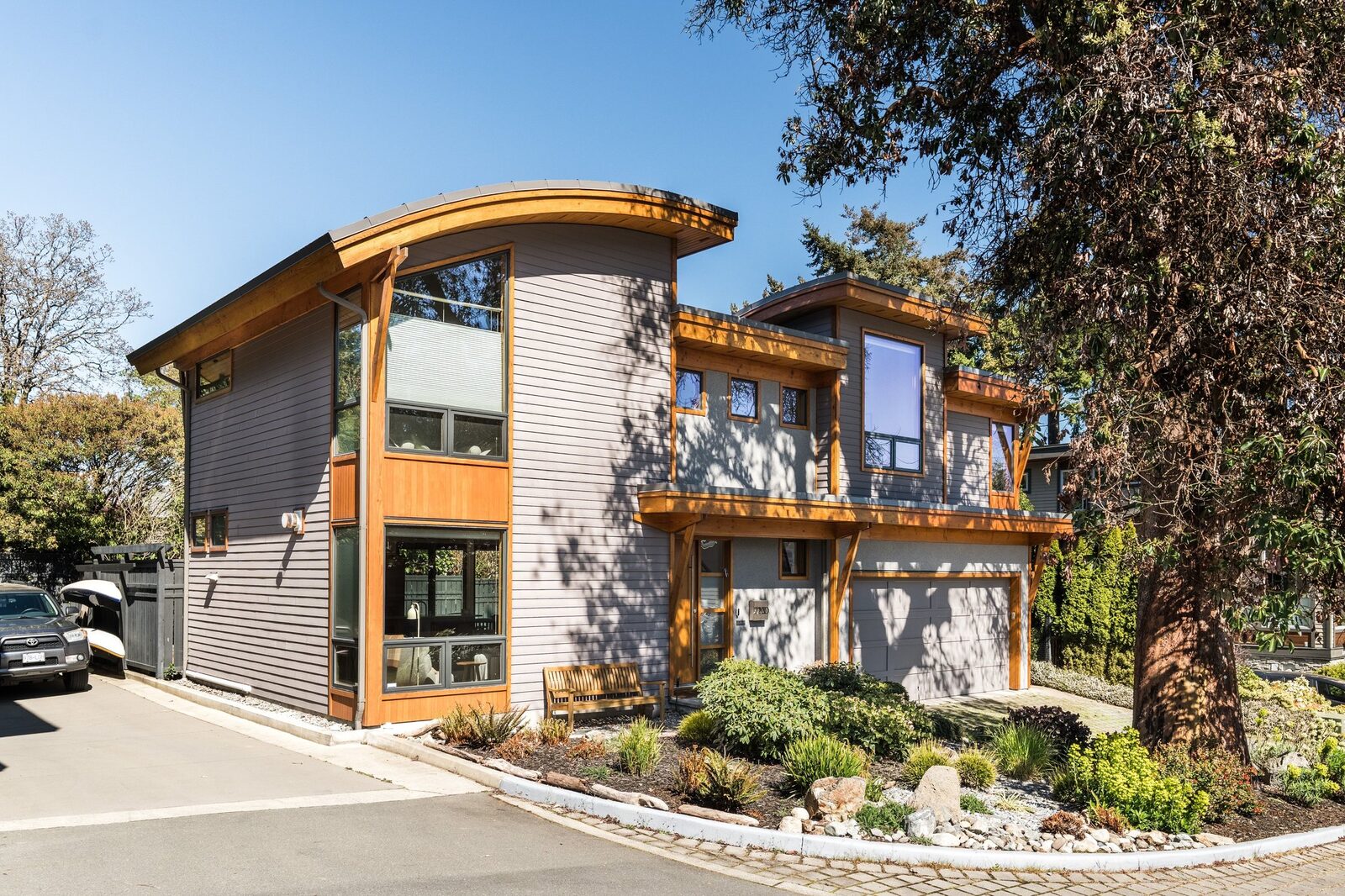 Front exterior showing curved roof and cedar accents