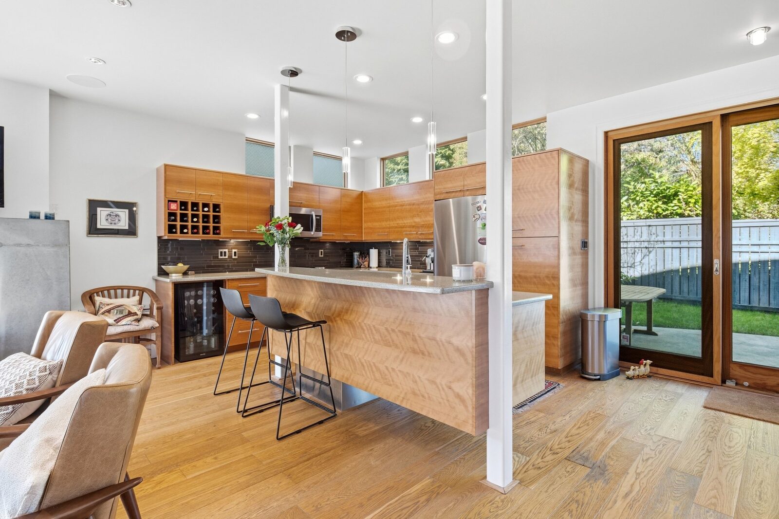 Kitchen with island, bar seating, and garden access