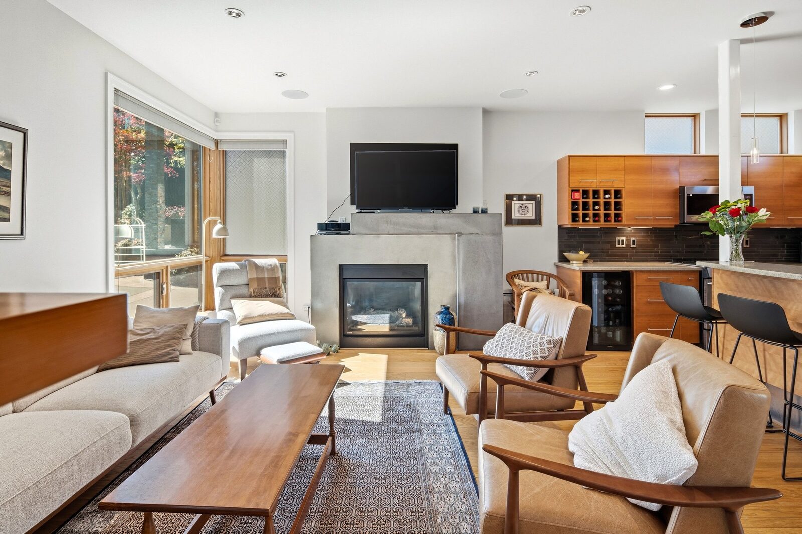 Living room with custom concrete gas fireplace